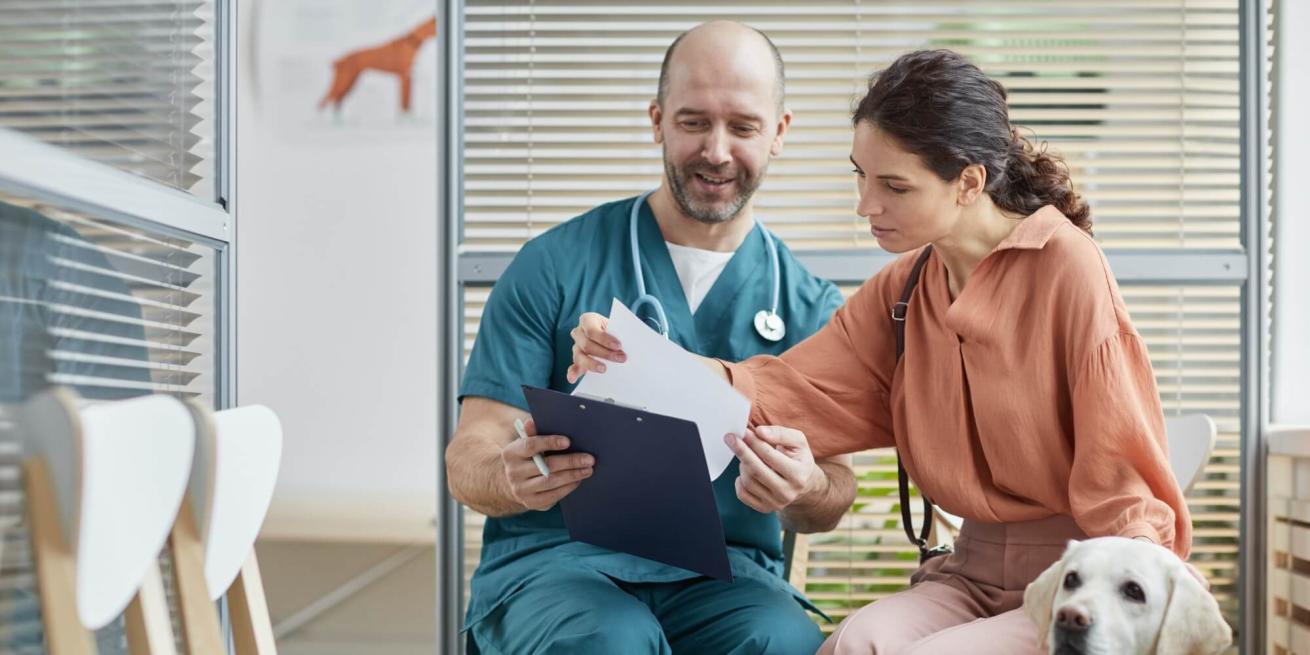 veterinarian talking about costs with client